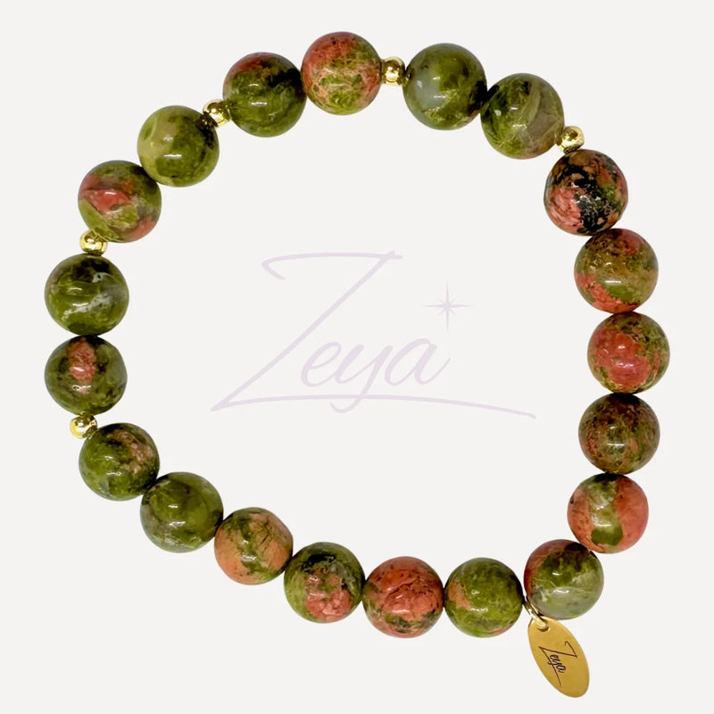 Le Bracelet Vitalis incarne la renaissance et la transformation intérieure. Associant la Unakite, pierre d’évolution personnelle, à l’acier inoxydable doré, il est conçu pour ceux qui cherchent à avancer avec sérénité et force.